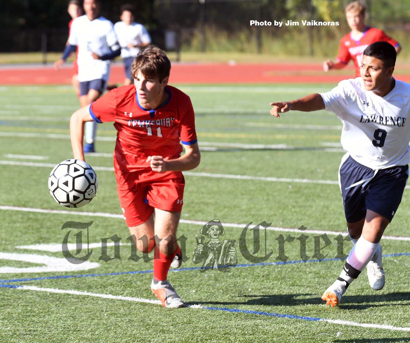 Tewksbury's Joseph Branchaud fights for the ball